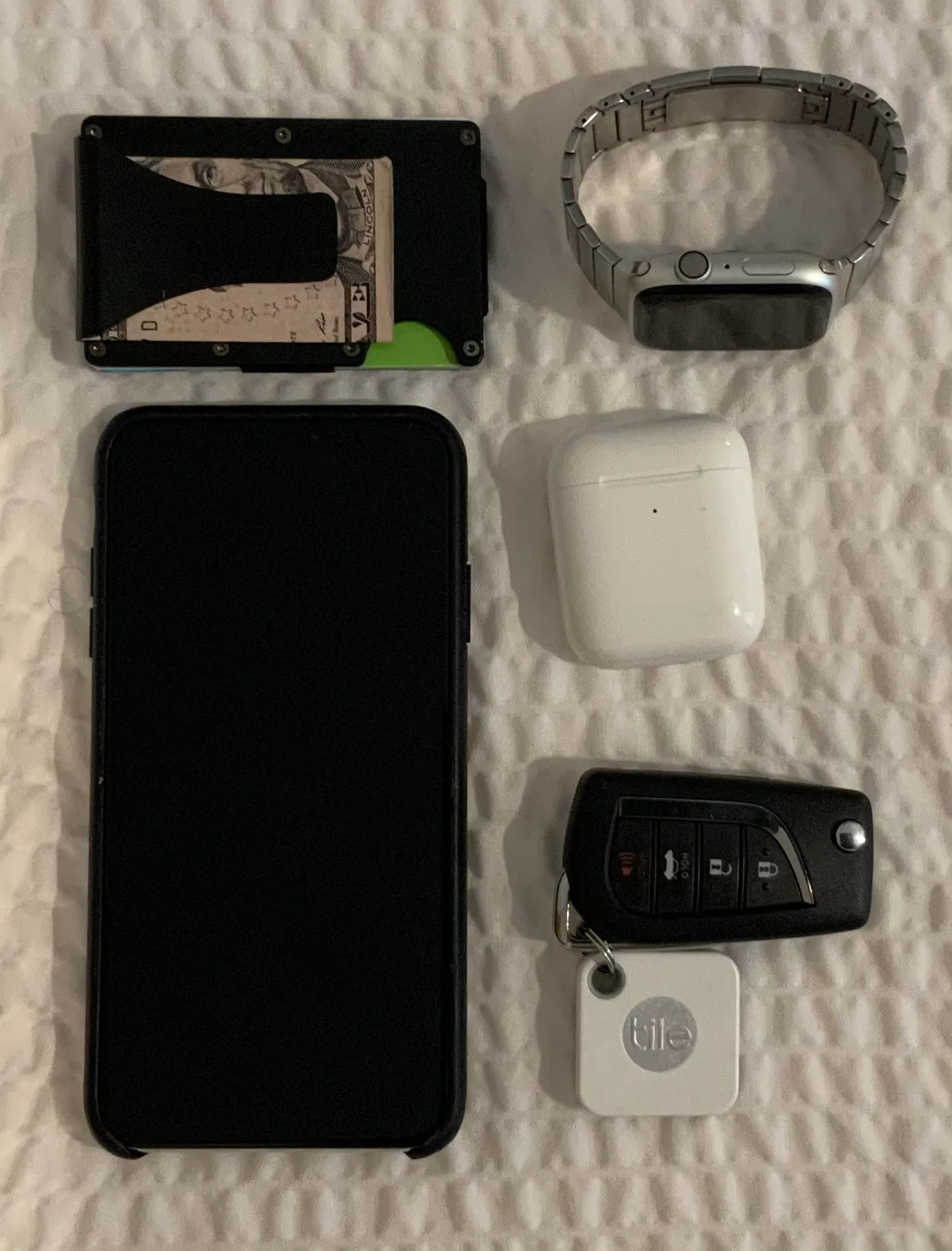Thought I would inspire myself with Adam Savage's knolling posts. Layflat knolling of phone, keys, wallet, AirPods and tile.